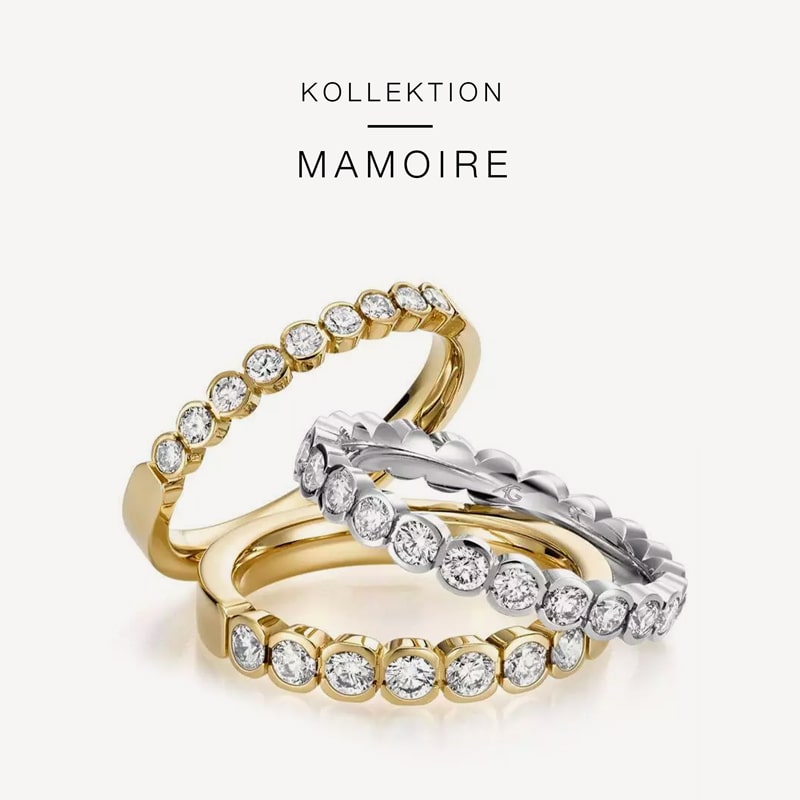 Juwelier-Morawitz-Gerstner-Kollektion-Mamoire Drei elegante Ringe mit Diamanten im Rundschliff sind auf weißem Hintergrund zu sehen. Zwei Ringe sind aus Gold, einer aus Silber. Die Diamanten sind in einer durchgehenden Linie um jeden Ring angeordnet. Der Text über den Ringen lautet „Kollektion Mamoire von Juwelier Morawitz, Düsseldorf“.