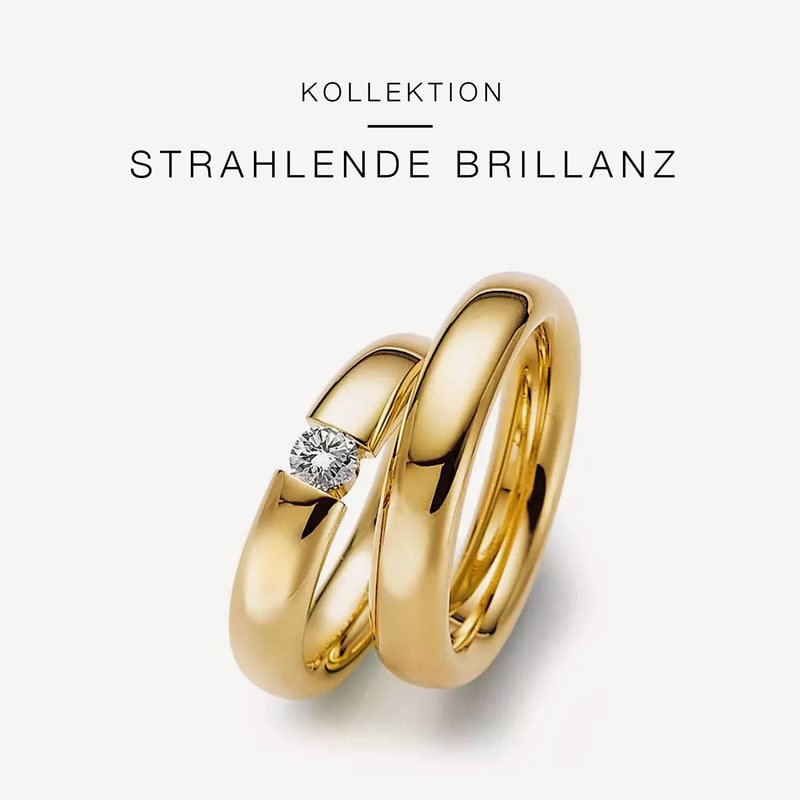 Juwelier-Morawitz-Gerstner-Kollektion-Strahlende-Brillanz Zwei Goldringe aus der Kollektion „Strahlende Brillanz“ von Juwelier Morawitz in Düsseldorf. Ein Ring ist mit einem einzelnen funkelnden Diamanten verziert, während der andere ein schlichtes, poliertes Goldband ist. Beide Ringe sind übereinander auf einem weißen Hintergrund gestapelt, darüber steht der Kollektionsname.