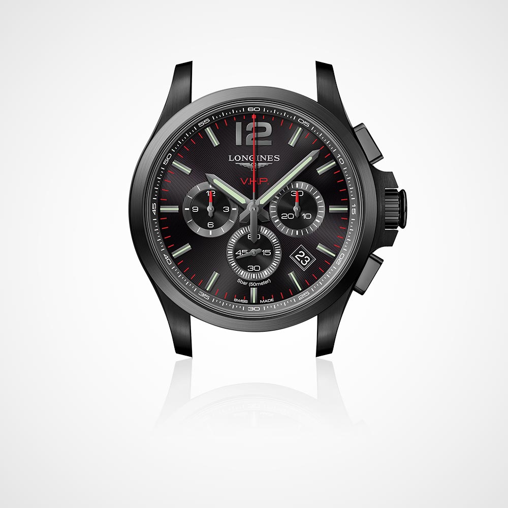 Juwelier-Morawitz-Uhrenlexikon-druecker Beschreibung: Eine elegante schwarze Armbanduhr mit rundem Zifferblatt und roten Akzenten von Juwelier Morawitz in Düsseldorf. Sie verfügt über drei kleinere Zifferblätter für zusätzliche Zeitmessfunktionen, ein Datumsfenster auf der 4-Uhr-Position und fettgedruckte Ziffern auf der 12-Uhr-Position. Der Hintergrund ist schlicht weiß.