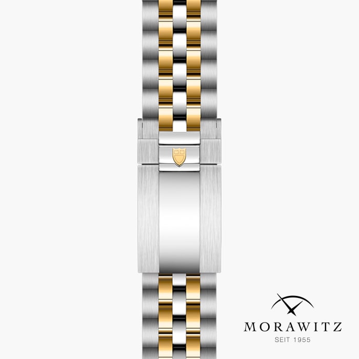 Eine Nahaufnahme eines Morawitz-Armbands mit zweifarbigem Design und abwechselnden silbernen und goldenen Gliedern. Das Morawitz-Logo und der Text „Morawitz seit 1955“ sind in der unteren rechten Ecke zu sehen.